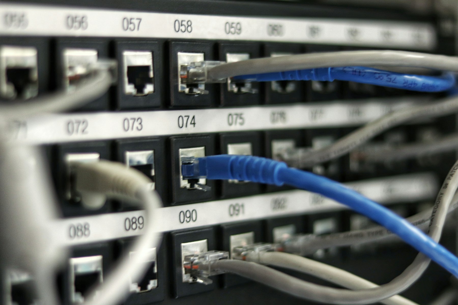 Neatly dressed patch panels and structured cabling in a network cabinet