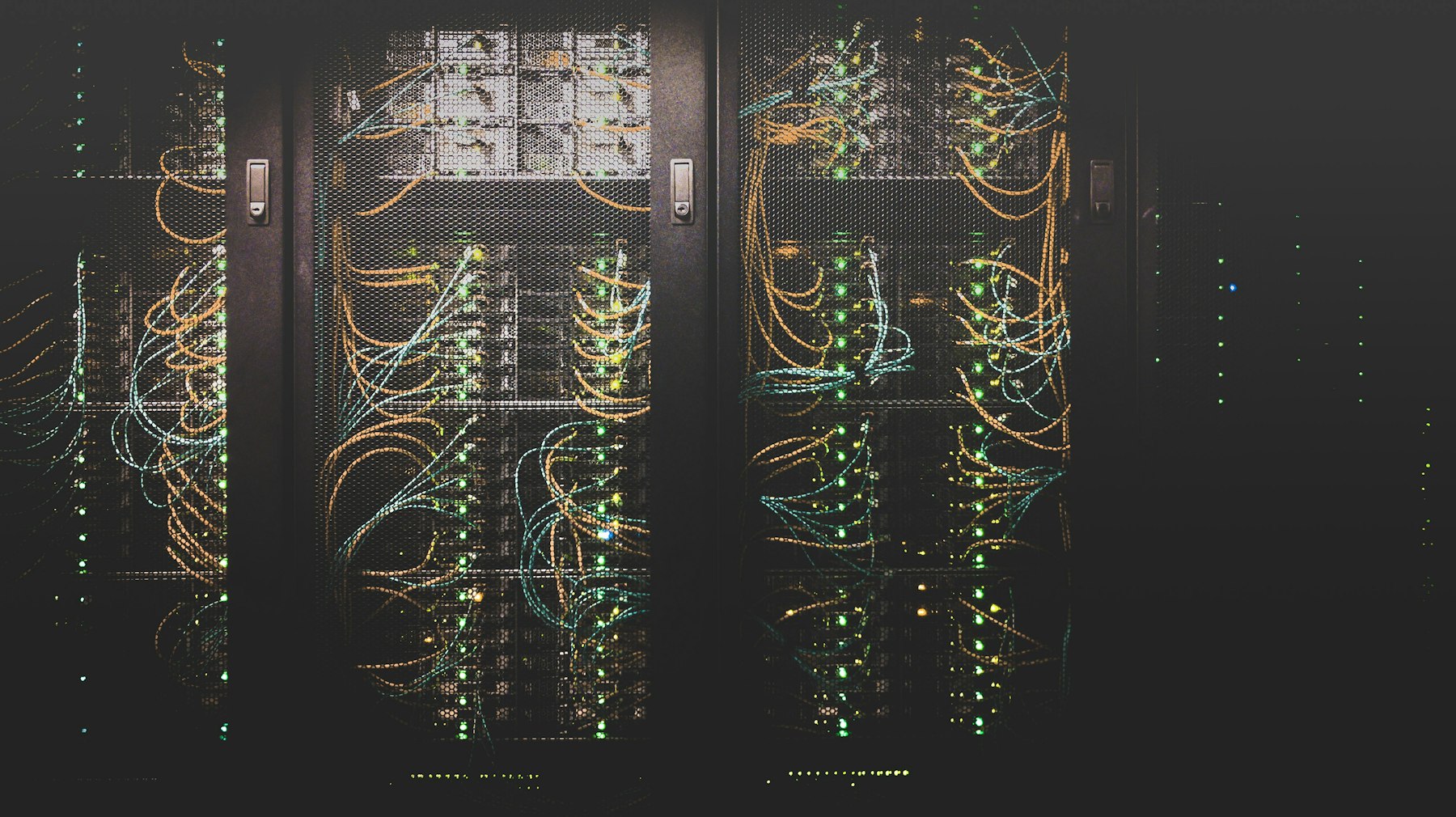 Data center racks with organized backbone cabling and network equipment