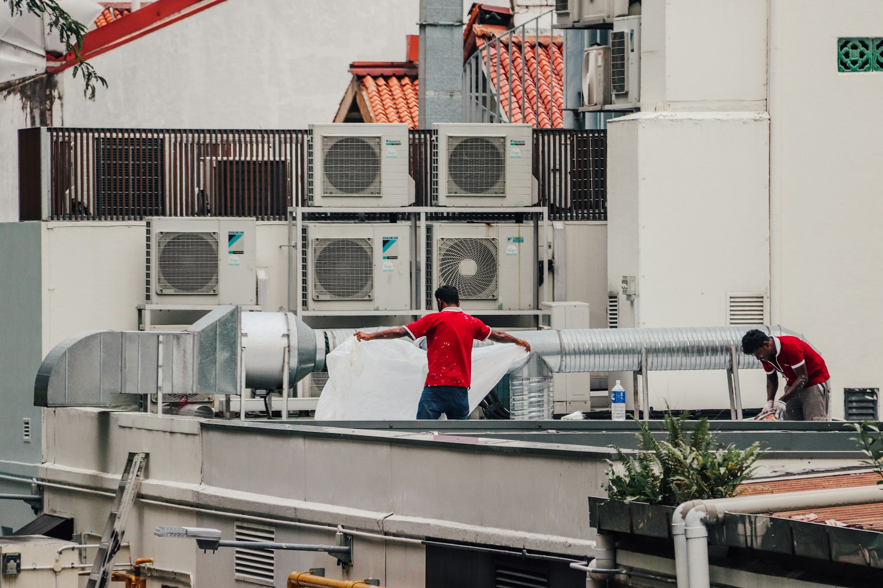 Technician servicing HVAC equipment